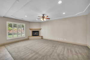Unfurnished living room with recessed lighting, ceiling fan, and baseboards