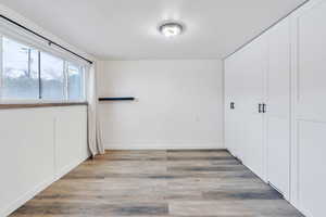 Interior space with light hardwood / wood-style floors and a closet