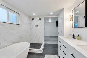 Bathroom with separate shower and tub and vanity