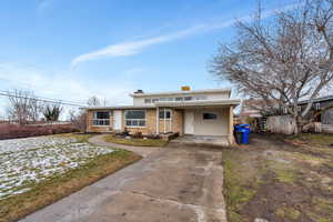 View of front of property featuring a carport