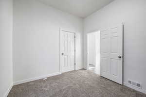 Unfurnished bedroom with carpet