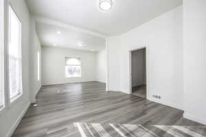 Unfurnished room featuring dark hardwood / wood-style flooring