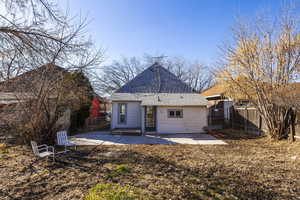 Back of property with a patio