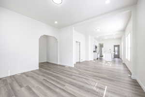 Unfurnished room featuring light wood-type flooring and sink