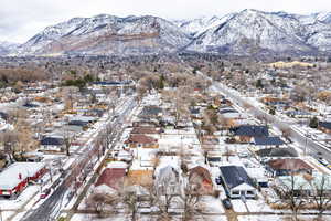 Snowy aerial view featuring a mountain view