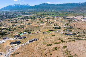 Birds eye view of property with a mountain view