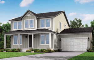 View of front of house featuring a front yard and a garage