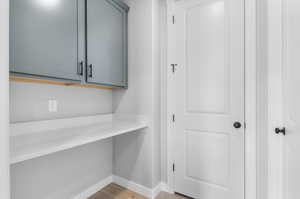 Detailed view of baseboards and wood finished floors