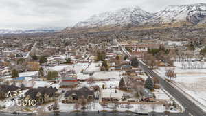 Snowy aerial view featuring a mountain view