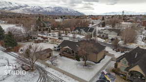 Snowy aerial view with a mountain view