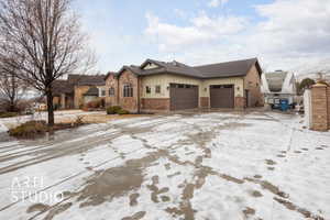 View of front of property featuring a garage