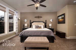 Master bedroom featuring ceiling fan