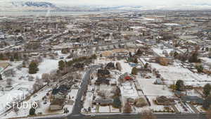 Snowy aerial view with a mountain view