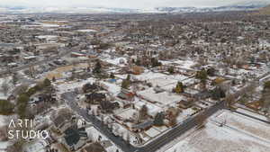 Snowy aerial view featuring a mountain view