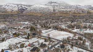 Snowy aerial view with a mountain view