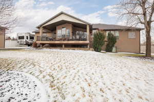 Rear view back of property featuring a deck