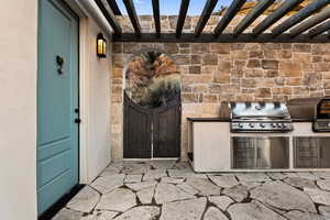 Entrance to property featuring an outdoor kitchen