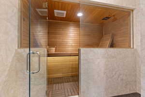 Bathroom with wooden ceiling and a shower with shower door