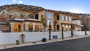 View of front facade featuring a mountain view and a balcony