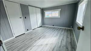 Unfurnished bedroom with light wood-type flooring