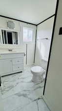 Bathroom with toilet and vanity