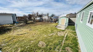 View of yard with a shed