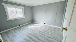 Empty room featuring light hardwood / wood-style flooring