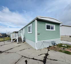 View of side of property featuring a patio