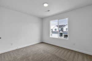 Unfurnished room featuring carpet flooring