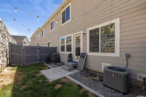 Rear view of house featuring central AC unit