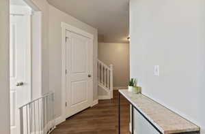 Hall featuring dark hardwood / wood-style flooring