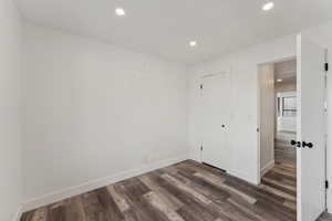 Interior space featuring dark wood-type flooring