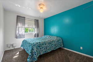 Bedroom featuring carpet flooring and ceiling fan