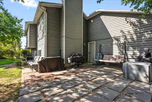 Back of property featuring a patio area