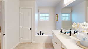 Bathroom featuring vanity and a bathtub