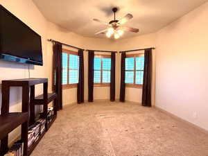 Interior space featuring ceiling fan and a wealth of natural light