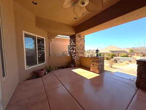 View of patio featuring ceiling fan