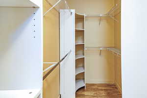 Bright spacious walk-in closet featuring with customized storage options