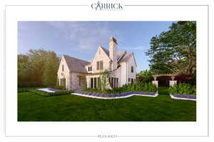 View of front of property featuring stone siding, fence, and a front lawn