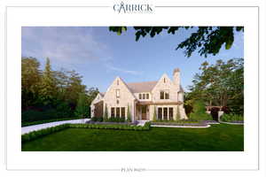 View of front of home with stone siding and a front lawn