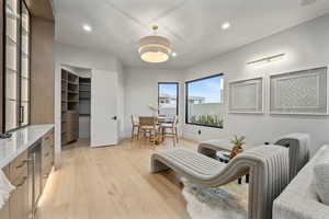 Living area with light hardwood / wood-style flooring