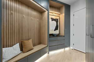 Mudroom with light wood-type flooring