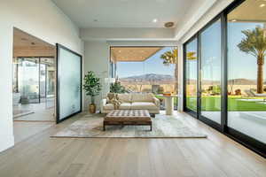 Sunroom featuring a mountain view