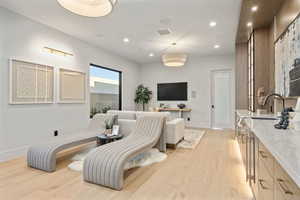 Living room with light hardwood / wood-style floors