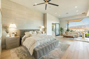 Bedroom featuring ceiling fan, light hardwood / wood-style flooring, and access to outside