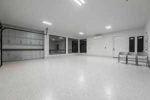 Garage featuring an AC wall unit