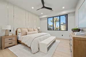 Bedroom featuring ceiling fan and light hardwood / wood-style flooring