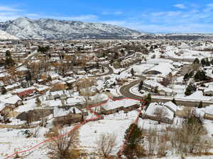 Snowy aerial view with a mountain view