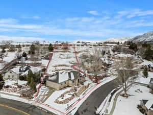 Snowy aerial view with a mountain view