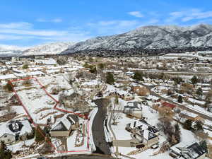 Snowy aerial view with a mountain view